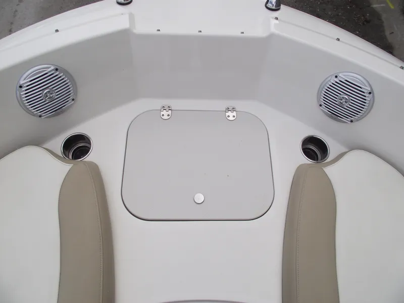 Slide: The Image of 2016 Stingray 182 SC boat interior with speakers and seating. - 7