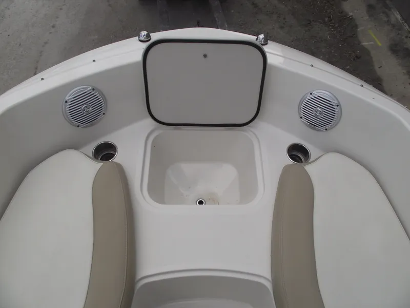 Slide: The Image of 2016 Stingray 182 SC boat interior with seating and speakers. - 8