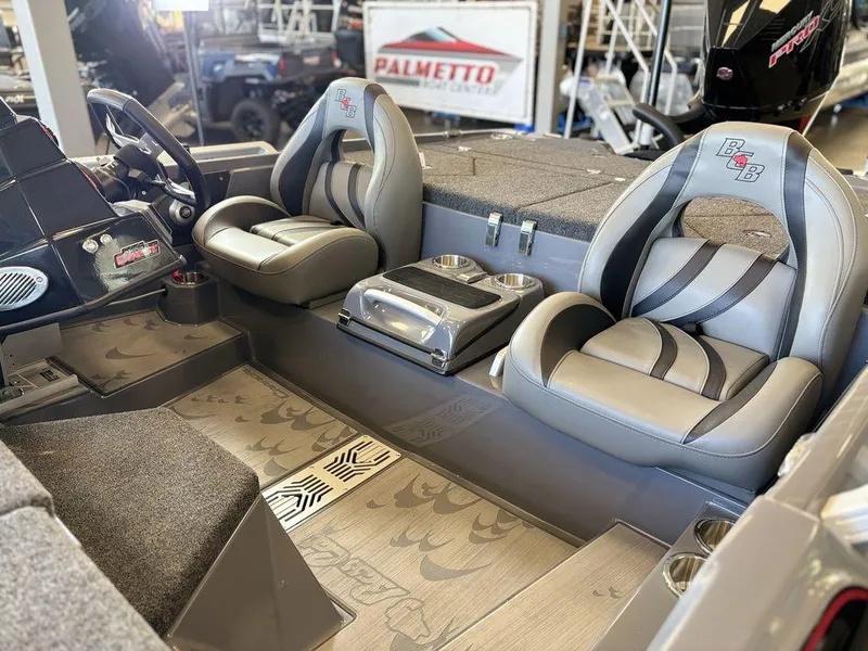 Slide: The Image of 2024 Bass Cat Caracal STS interior with dual seats and modern dashboard design. - 5