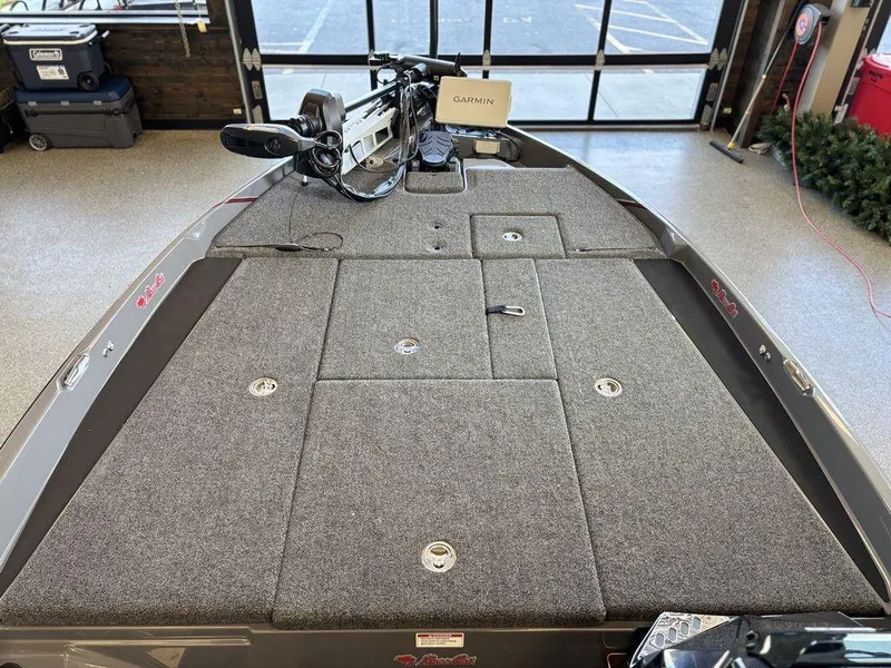 Slide: The Image of 2024 Bass Cat Caracal STS boat deck with Garmin equipment in a showroom. - 7