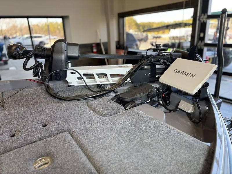 Slide: The Image of 2024 Bass Cat Caracal STS boat with Garmin navigation system on deck. - 8