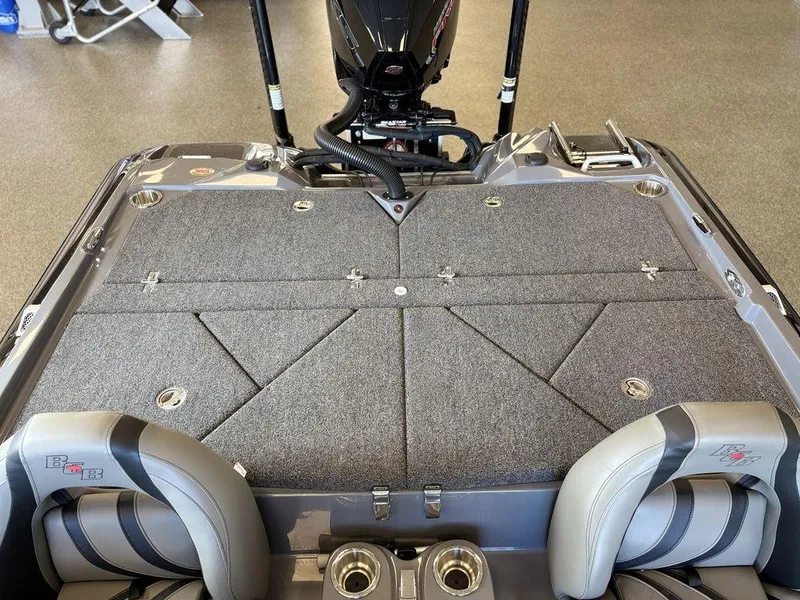 Slide: The Image of 2024 Bass Cat Caracal STS boat interior with cushioned seating and storage compartments. - 9