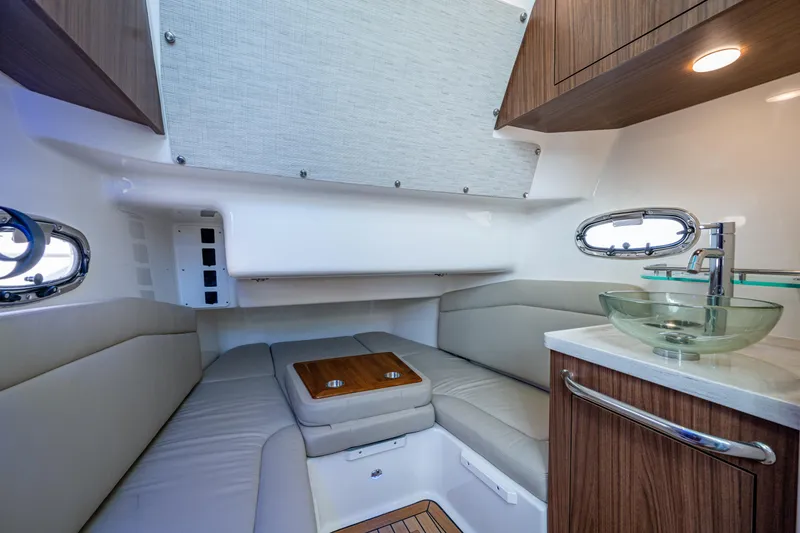Slide: The Image of Luxurious interior of 2024 Boston Whaler 380 Outrage with modern seating and glass sink. - 31