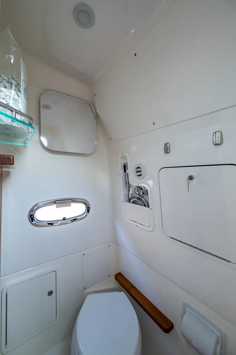 Slide: The Image of 2024 Boston Whaler 380 Outrage bathroom interior with modern fixtures and compact design. - 35