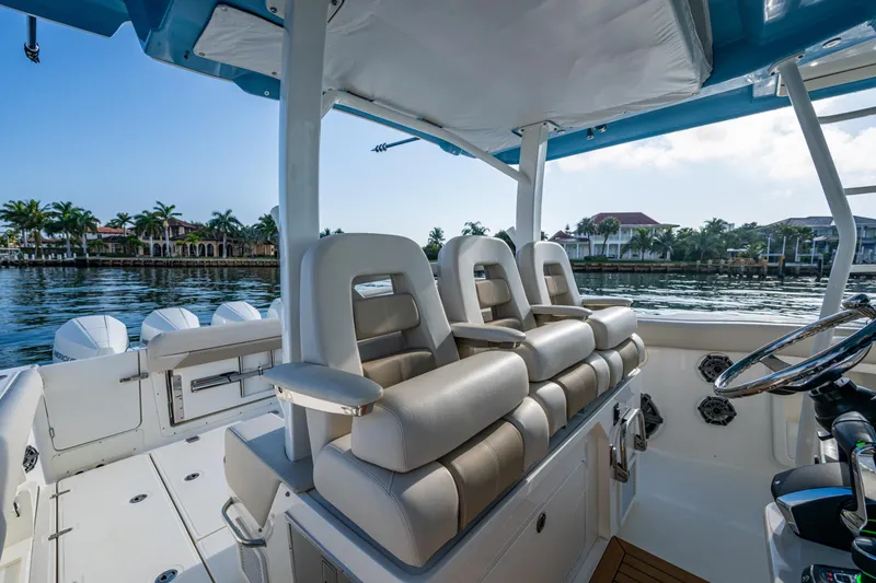 Slide: The Image of 2024 Boston Whaler 380 Outrage interior with luxurious seating and waterfront view. - 41