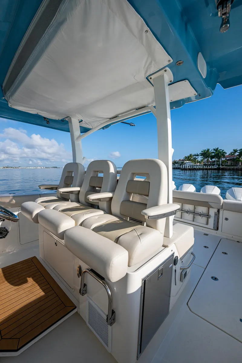 Slide: The Image of 2024 Boston Whaler 380 Outrage boat interior with luxurious seating and ocean view. - 43