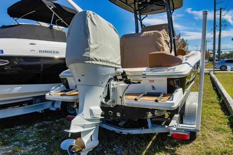 Slide: The Image of 2021 Pioneer 202 Islander boat with covered outboard motor on trailer. - 1