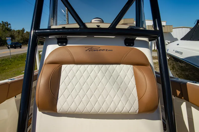 Slide: The Image of 2021 Pioneer 202 Islander boat seat with brown and white diamond-patterned upholstery. - 20