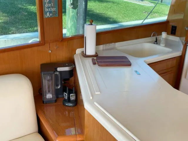 Slide: The Image of Interior of 1999 Viking 50 Convertible yacht with kitchen counter and coffee maker. - 24