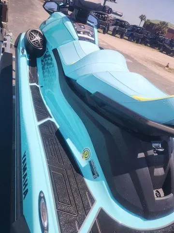 Slide: The Image of 2025 Yamaha WaveRunner VX Limited Ho in vibrant blue, parked outdoors. - 2