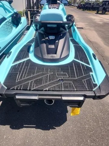 Slide: The Image of 2025 Yamaha WaveRunner VX Limited Ho in vibrant blue, rear view on pavement. - 4