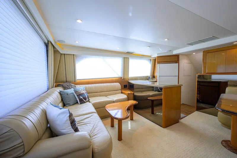 Slide: The Image of Luxurious interior of a 2000 Viking 50 Convertible yacht with plush seating and modern amenities. - 10