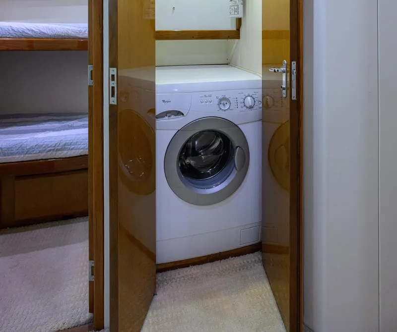 Slide: The Image of Laundry area with washer in 2000 Viking 50 Convertible yacht interior. - 26