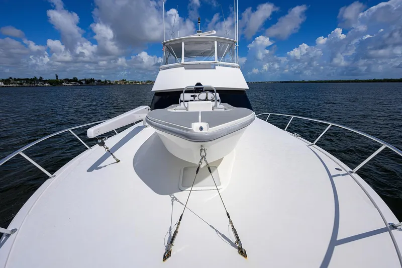 Slide: The Image of 2000 Viking 50 Convertible yacht on open water under blue sky. - 28