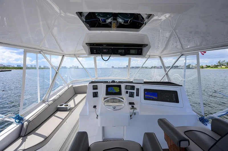 Slide: The Image of Interior view of a 2000 Viking 50 Convertible yacht helm with navigation equipment. - 38