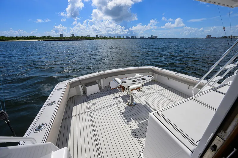 Slide: The Image of Viking 50 Convertible 2000 yacht deck overlooking calm waters and distant skyline. - 45