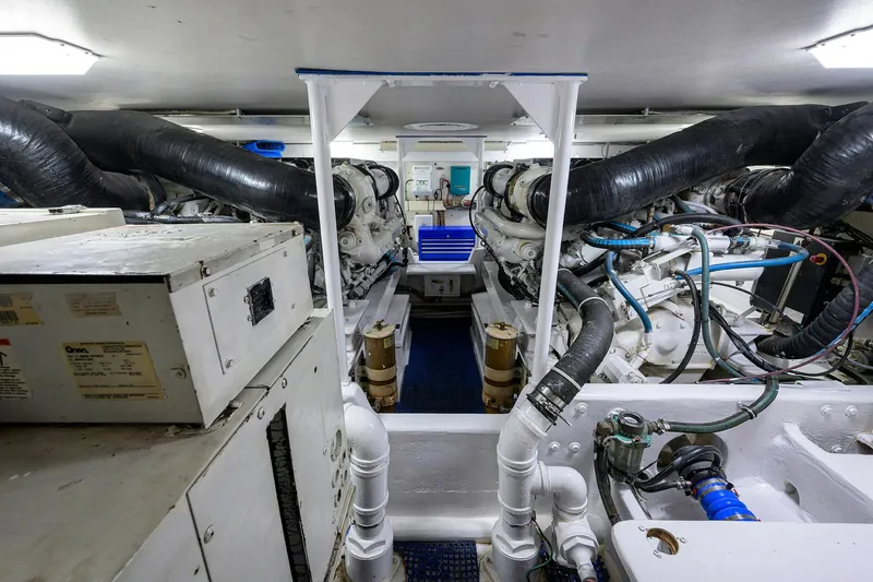 Slide: The Image of Engine room of 2000 Viking 50 Convertible yacht, showcasing machinery and equipment. - 49