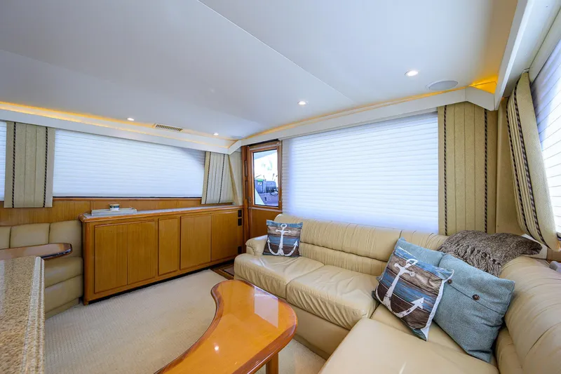 Slide: The Image of Luxurious interior of 2000 Viking 50 Convertible yacht with plush seating and elegant decor. - 8