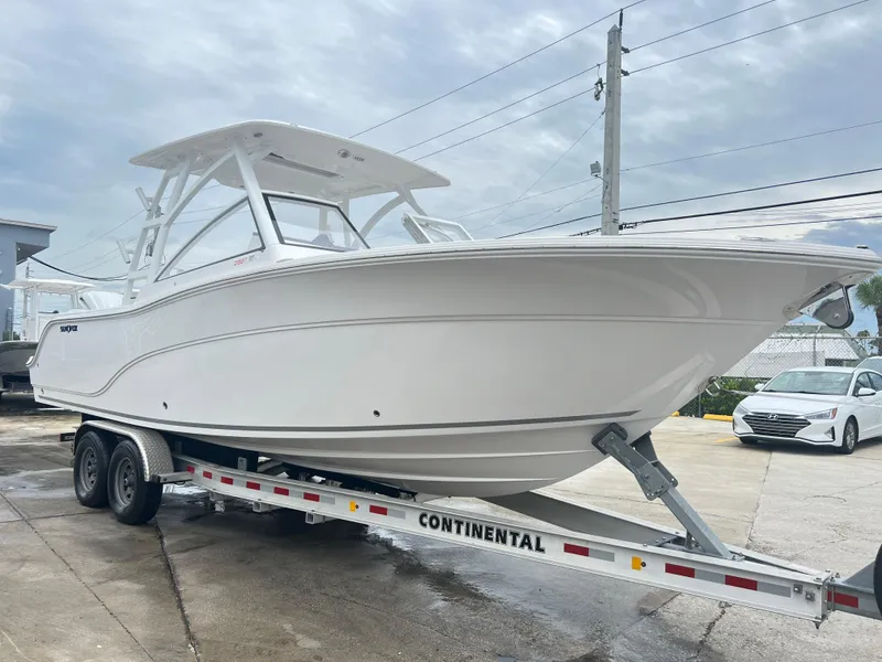 The Image of 2025 Sea Fox 288 Traveler boat on a Continental trailer, parked outdoors. - 0