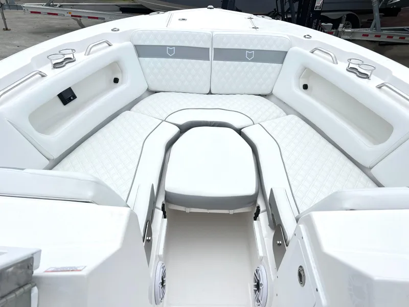 Slide: The Image of 2025 Sea Fox 288 Traveler boat interior with white cushioned seating and modern design. - 11