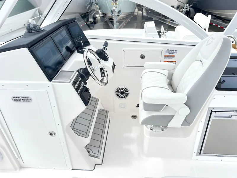 Slide: The Image of 2025 Sea Fox 288 Traveler helm with modern controls and comfortable seating. - 27