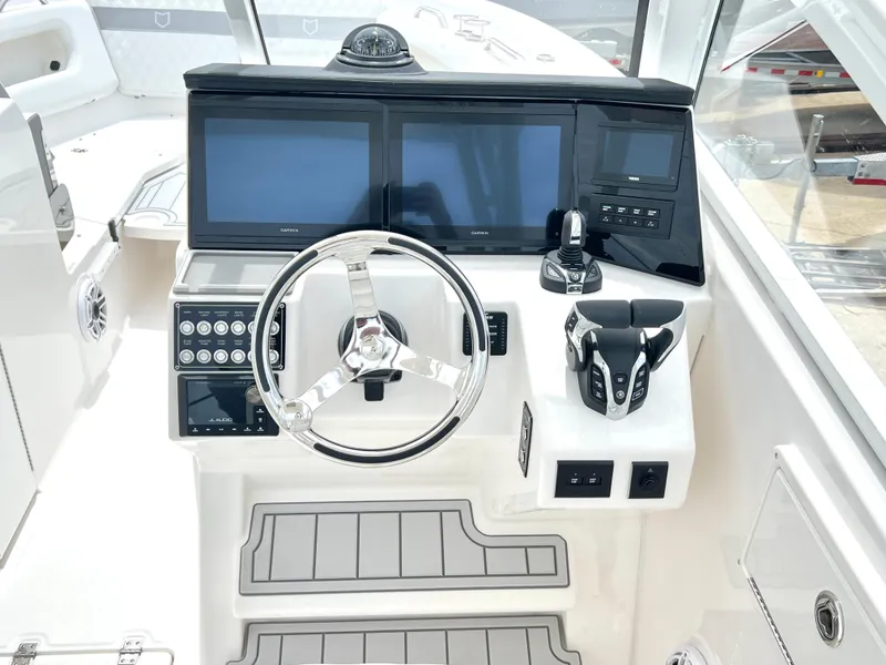 Slide: The Image of Helm of 2025 Sea Fox 288 Traveler with modern controls and dual screens. - 28