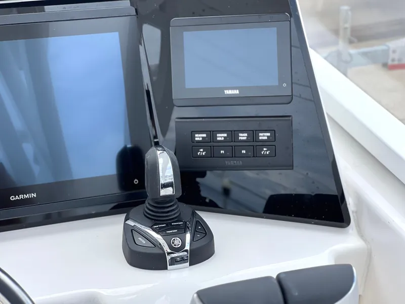 Slide: The Image of Control panel of 2025 Sea Fox 288 Traveler with Garmin and Yamaha displays. - 30