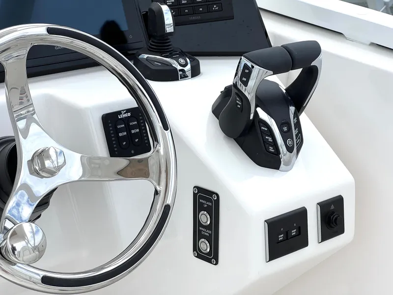 Slide: The Image of Helm of 2025 Sea Fox 288 Traveler boat with steering wheel and controls. - 31