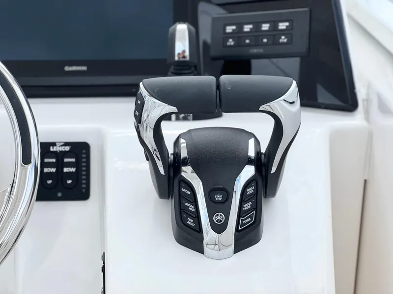 Slide: The Image of 2025 Sea Fox 288 Traveler boat controls with modern dashboard and steering wheel. - 32