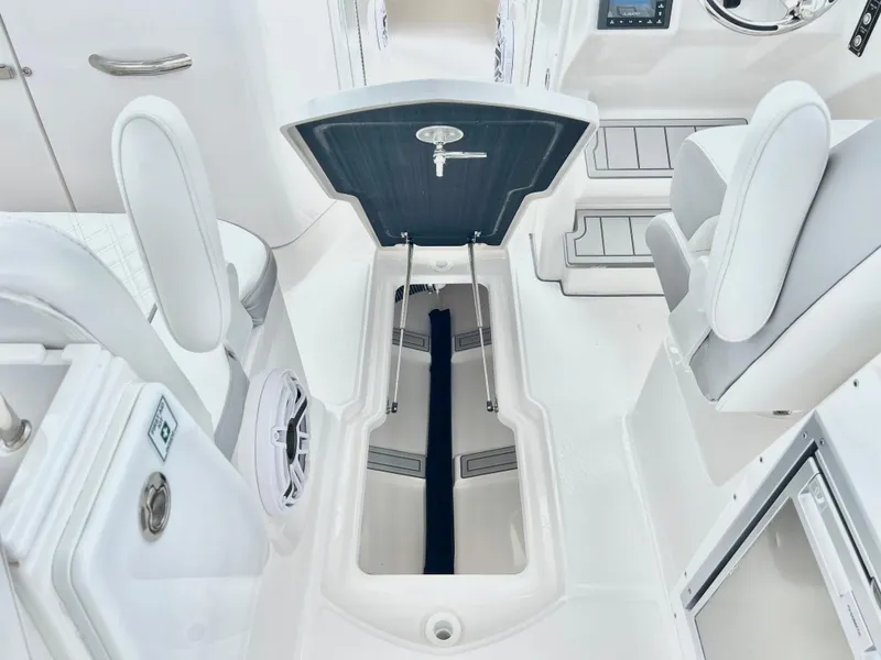 Slide: The Image of 2025 Sea Fox 288 Traveler boat interior with open storage compartment and seating. - 34