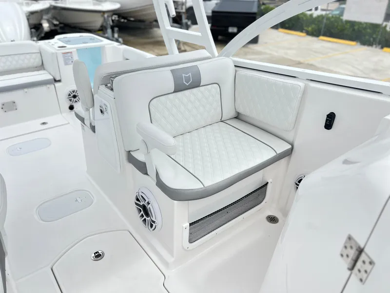 Slide: The Image of Luxurious seating on 2025 Sea Fox 288 Traveler boat, featuring white quilted upholstery. - 38