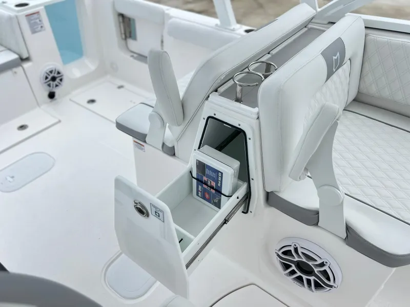 Slide: The Image of 2025 Sea Fox 288 Traveler boat interior with storage compartment and cup holders. - 39