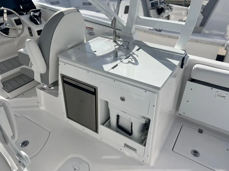 Slide: The Image of 2025 Sea Fox 288 Traveler boat interior with sink and storage area. - 49