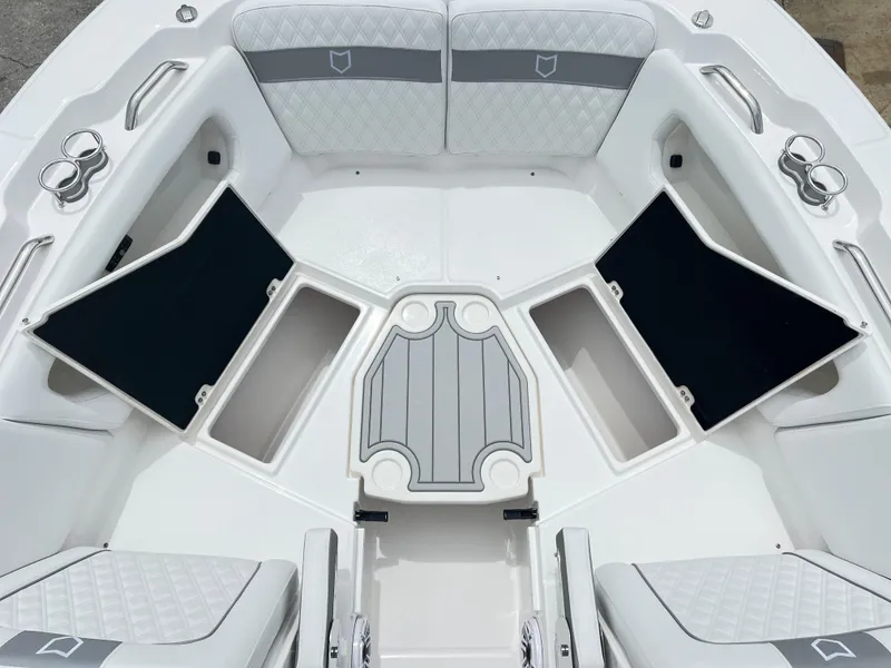 Slide: The Image of 2025 Sea Fox 288 Traveler boat interior with open storage compartments and cushioned seating. - 9