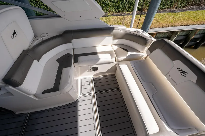 Slide: The Image of 2014 Monterey 295 Sport Yacht interior with sleek seating and modern design. - 14