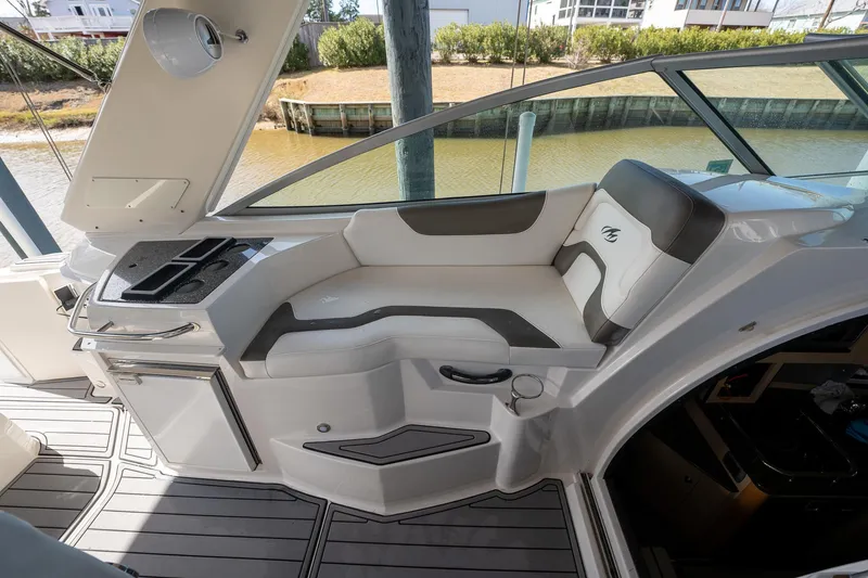 Slide: The Image of 2014 Monterey 295 Sport Yacht interior with sleek seating and modern design. - 15