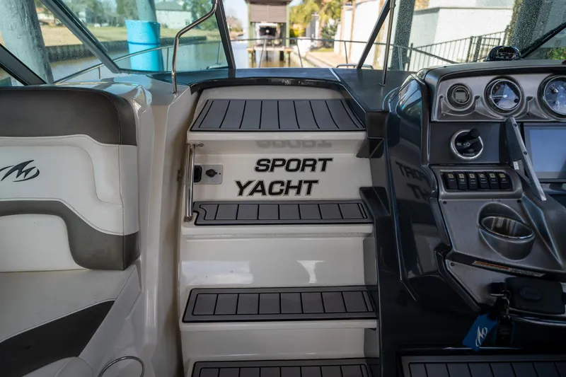 Slide: The Image of Interior view of 2014 Monterey 295 Sport Yacht, featuring dashboard and seating. - 18
