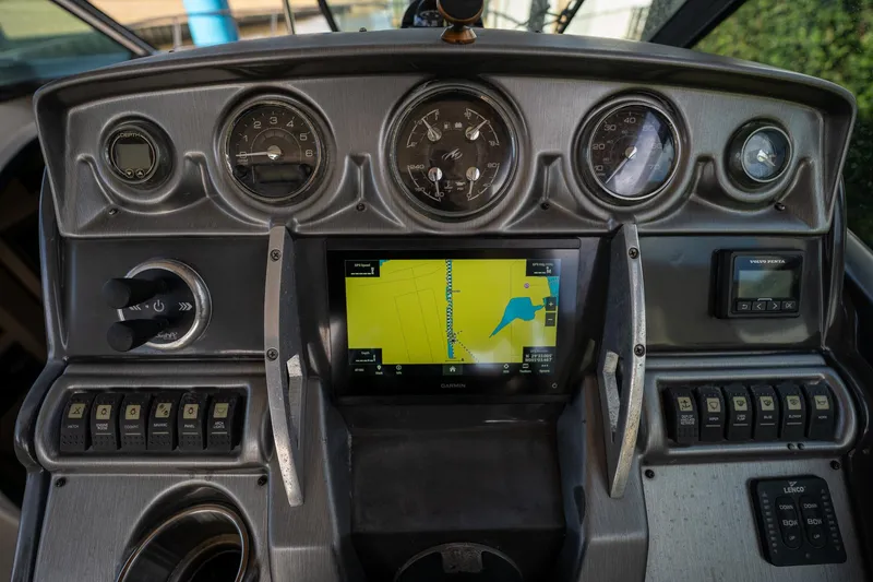 Slide: The Image of Dashboard of 2014 Monterey 295 Sport Yacht with navigation display and gauges. - 23