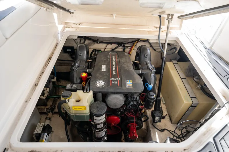 Slide: The Image of Engine compartment of a 2014 Monterey 295 Sport Yacht, featuring a Volvo Penta V8 engine. - 32