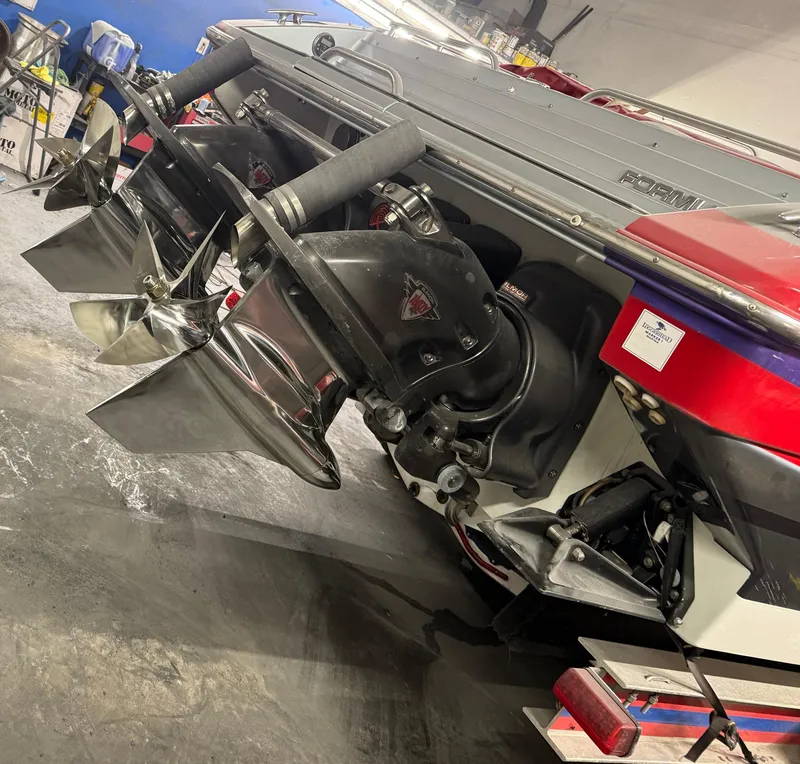 Slide: The Image of 2014 Formula 382 FASTech boat with dual propellers in a garage setting. - 10