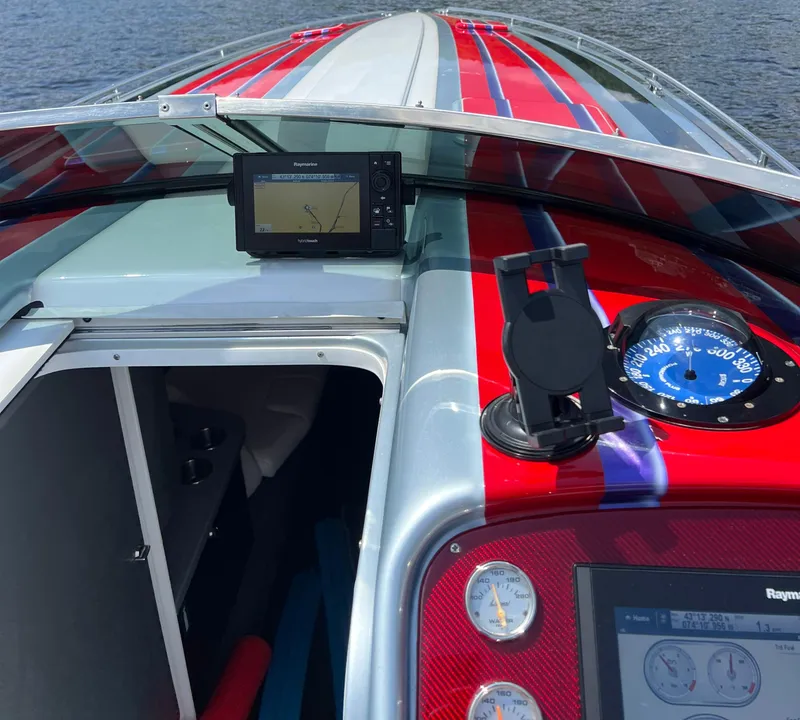 Slide: The Image of 2014 Formula 382 FASTech boat dashboard with navigation system and gauges. - 14