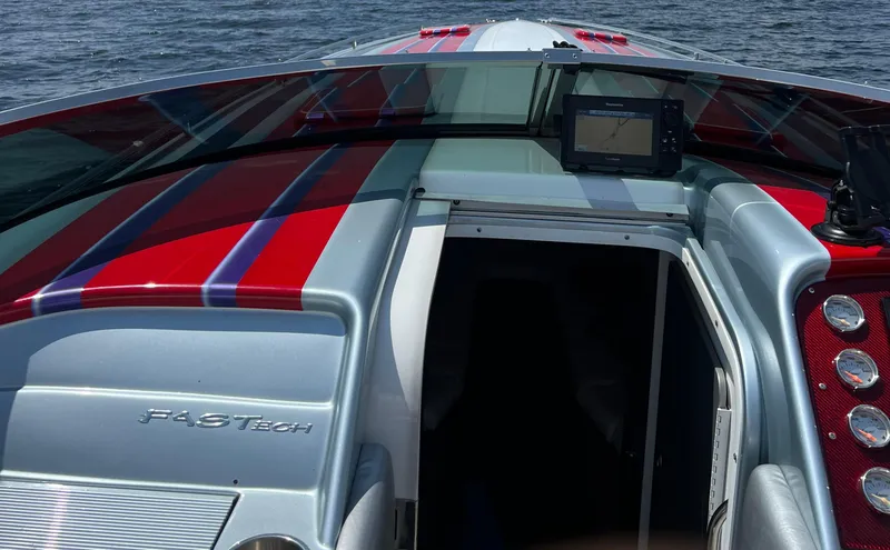 Slide: The Image of 2014 Formula 382 FASTech boat with vibrant red and blue stripes on open water. - 15