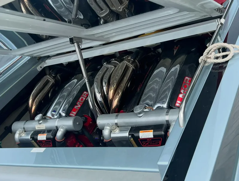 Slide: The Image of 2014 Formula 382 FASTech engine compartment with high-performance components and polished metal parts. - 16