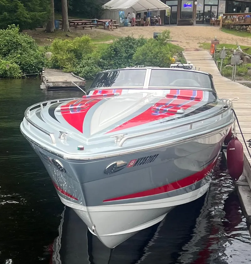 Slide: The Image of 2014 Formula 382 FASTech boat docked by a lakeside restaurant. - 3