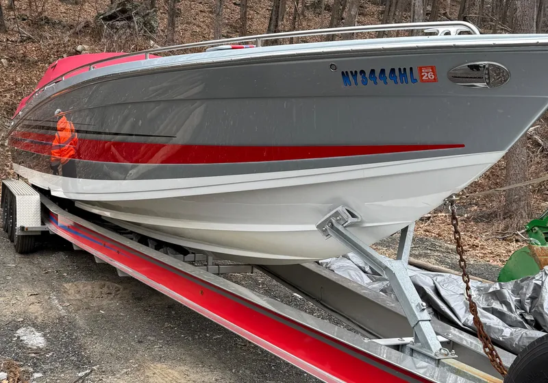 Slide: The Image of 2014 Formula 382 FASTech boat on trailer, gray and red design, parked outdoors. - 4