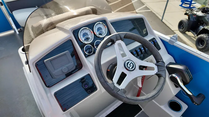 Slide: The Image of 2025 Sylvan MIRAGE 818 CRS boat dashboard with steering wheel and control panel. - 10