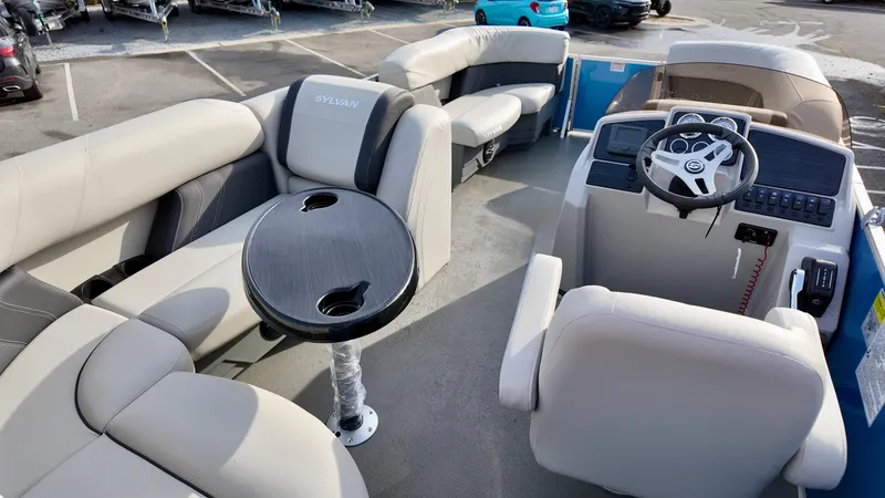 Slide: The Image of 2025 Sylvan MIRAGE 818 CRS pontoon boat interior with seating and steering console. - 15