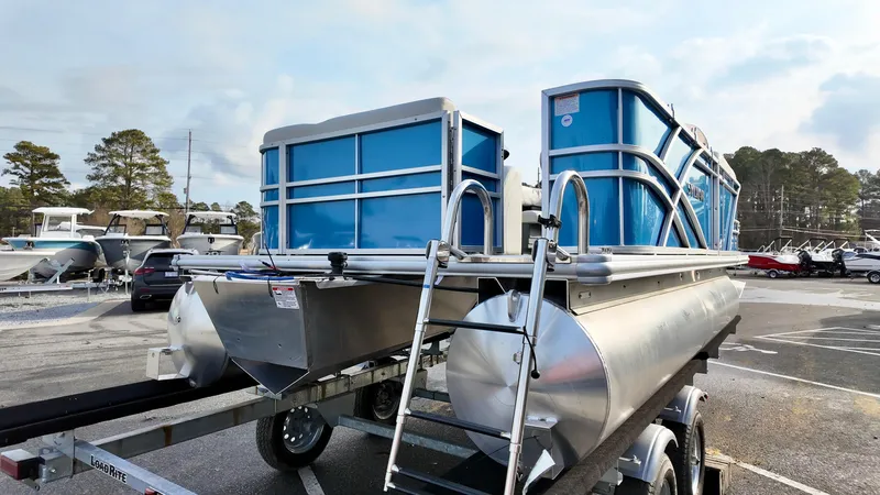 Slide: The Image of 2025 Sylvan MIRAGE 818 CRS pontoon boat on trailer in parking lot. - 5