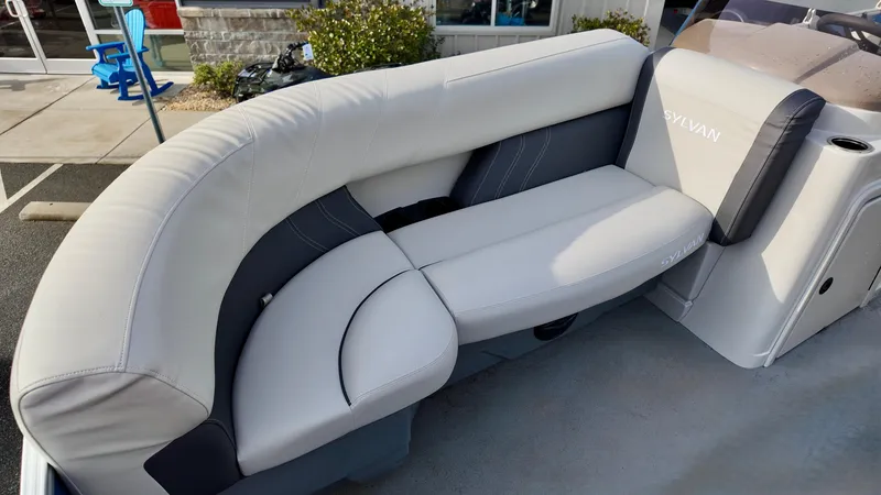 Slide: The Image of 2025 Sylvan MIRAGE 818 CRS boat interior with sleek, modern seating design. - 8