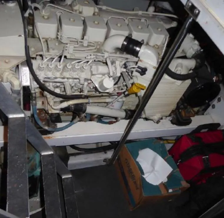Slide: The Image of Engine compartment of a 2003 Silverton 410 Sport Bridge yacht, showing mechanical components. - 8